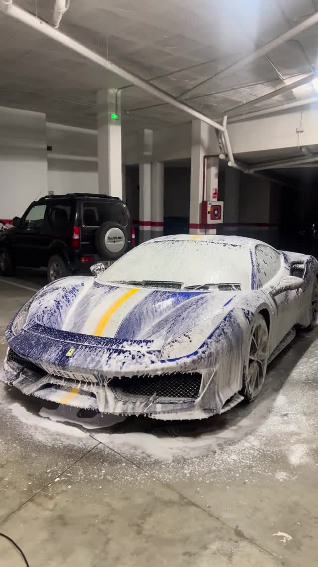 Sports car covered in cleaning foam